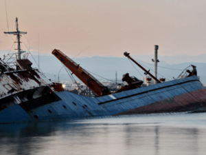 A photo of a ship sinking in the ocean.